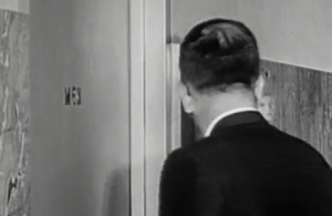 Hank Cameron entering a men's bathroom. Why? (Photo by Brian Schropp)